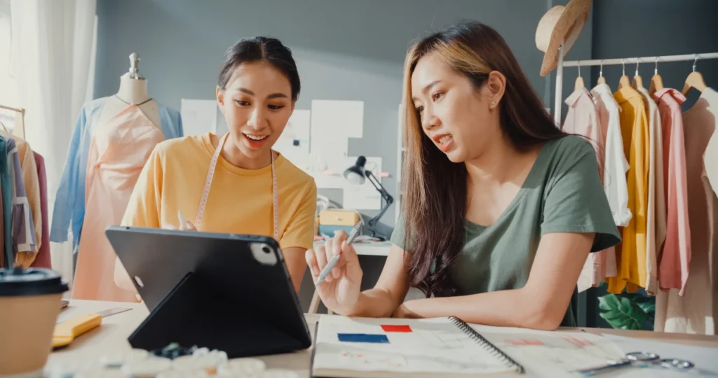 two merchants from an apparel company discussing the product line briefing