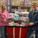 VibeIQ team members helping sort and create outfits for kids at Cradles to Crayons in Newton, MA